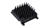 Black metal heat sink with vertical fins, mounted on a flat base with four corner holes for attachment, designed for cooling electronic components.
