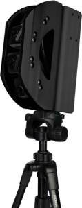 A black camera-like device mounted on a tripod, featuring a rectangular housing with visible screws and angular edges.